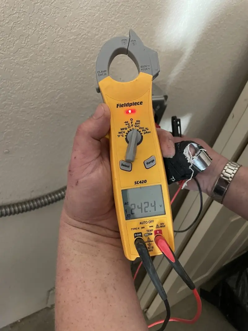 Voltage testing with clamp meter during Outlet Installation in Waltham